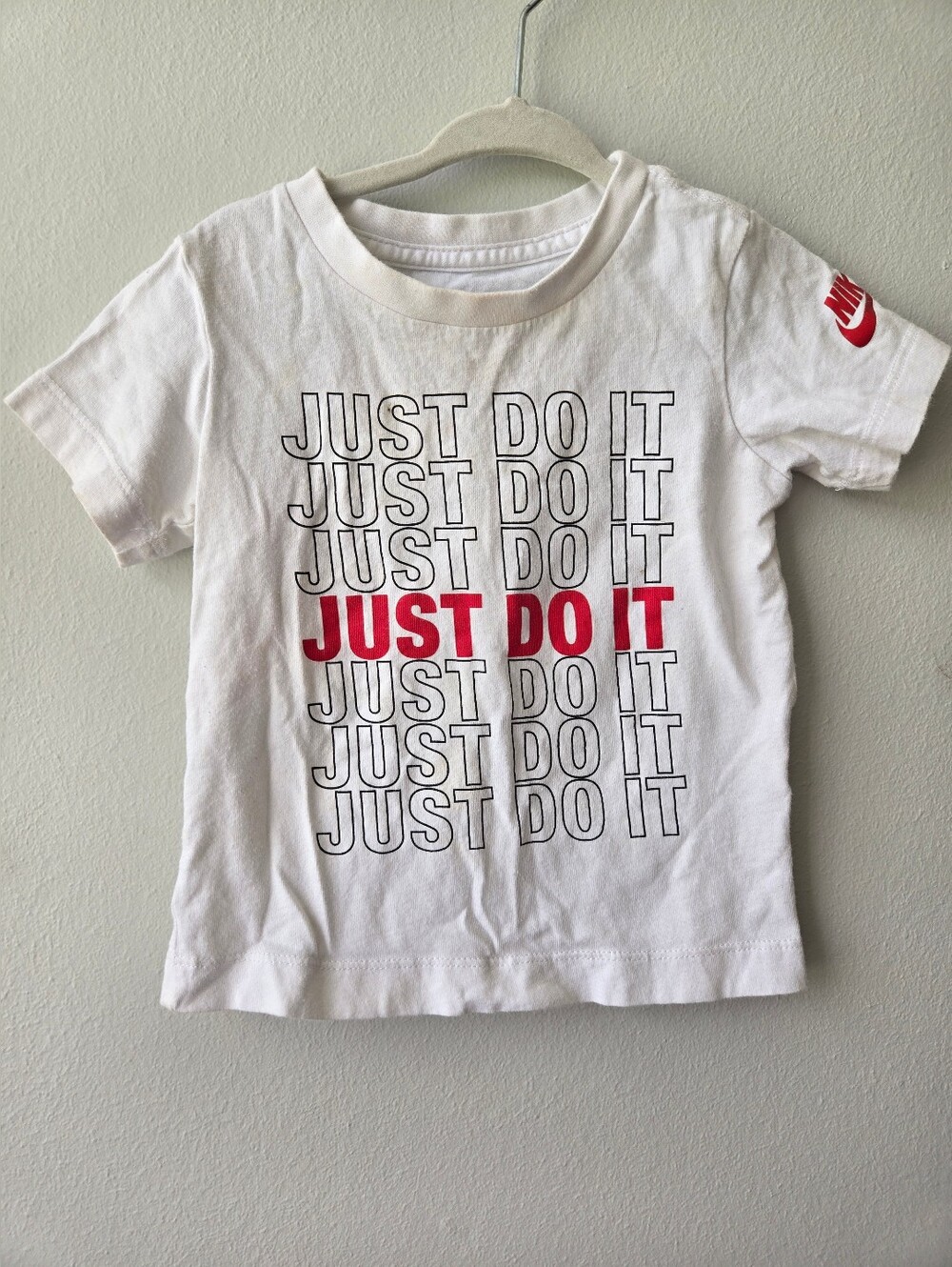 Nike Kids White Tee with Red 'Just Do It' Graphic